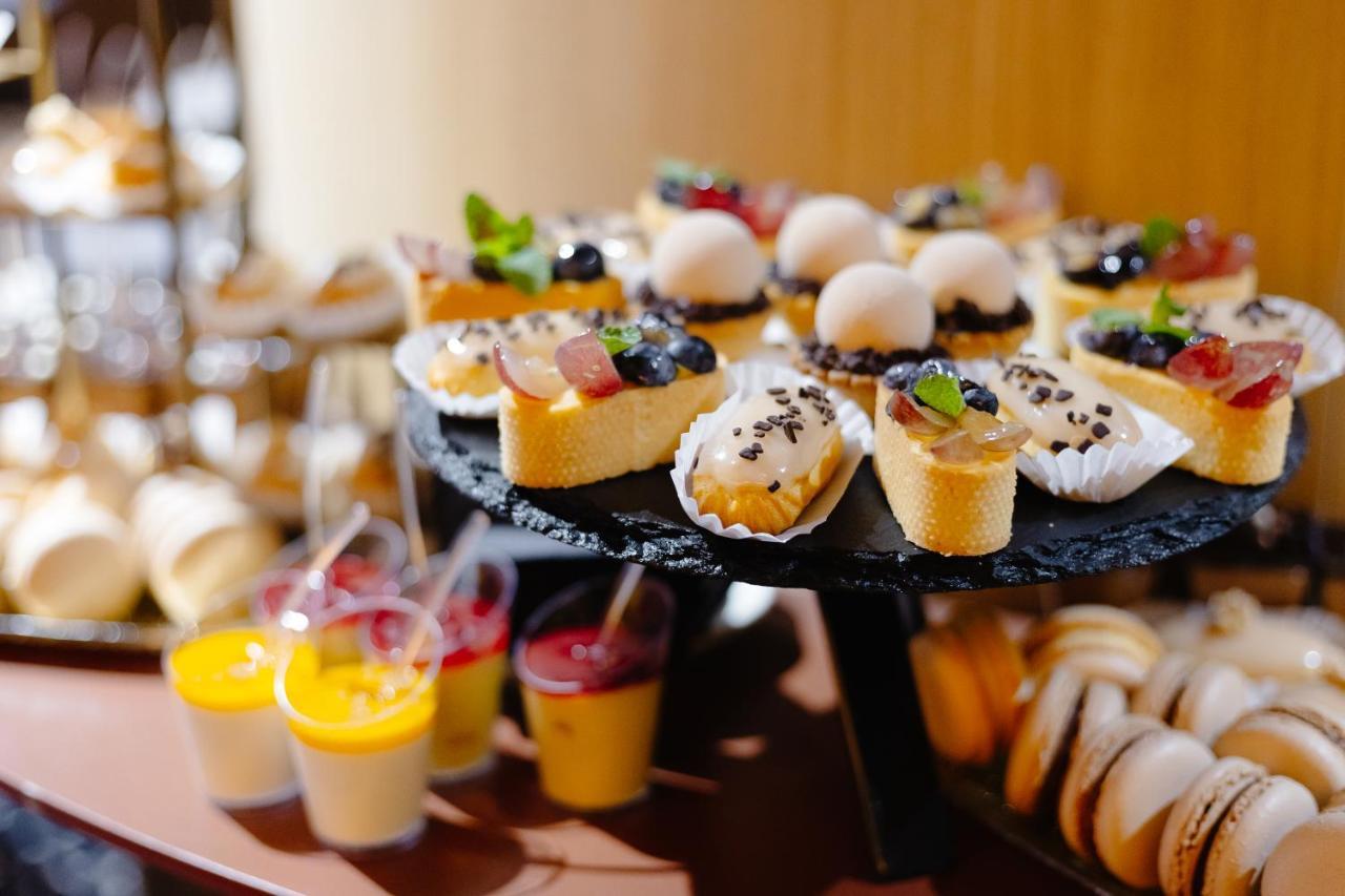 Emily Resort Lviv Extérieur photo A selection of desserts